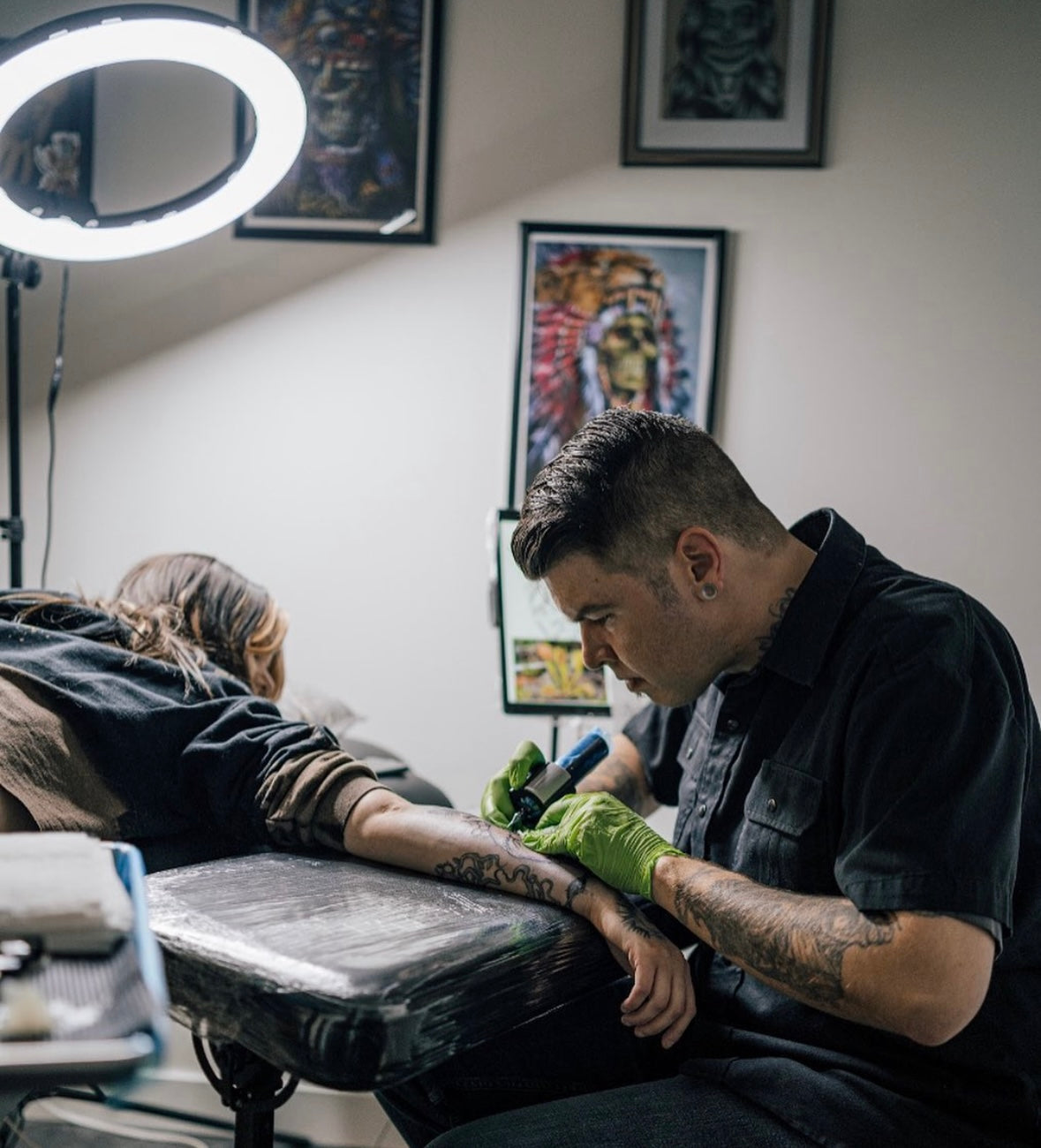 Tattoo Artist in Airdrie Alberta tattooing at Sundog Studios