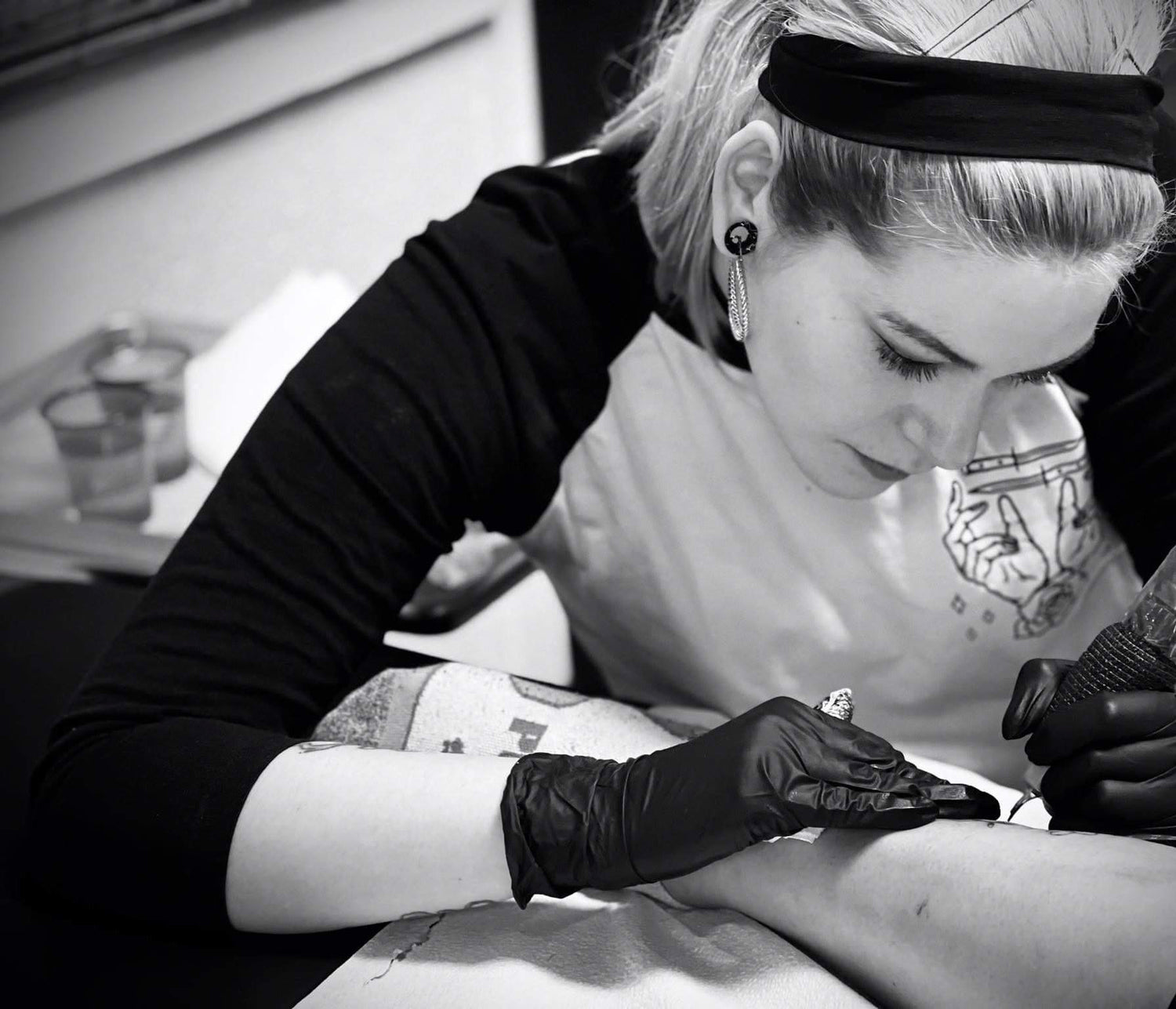 Tattoo Artist in Airdrie Alberta tattooing at Sundog Studios