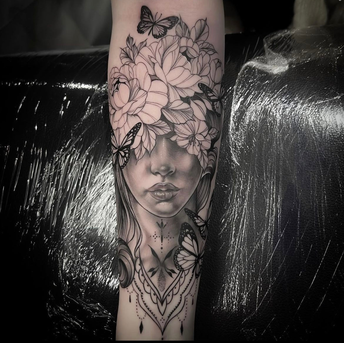 Floral and female face ornate fine line tattoo done by Yvon_ink at Sundog Studios Airdrie Tattoo Shop