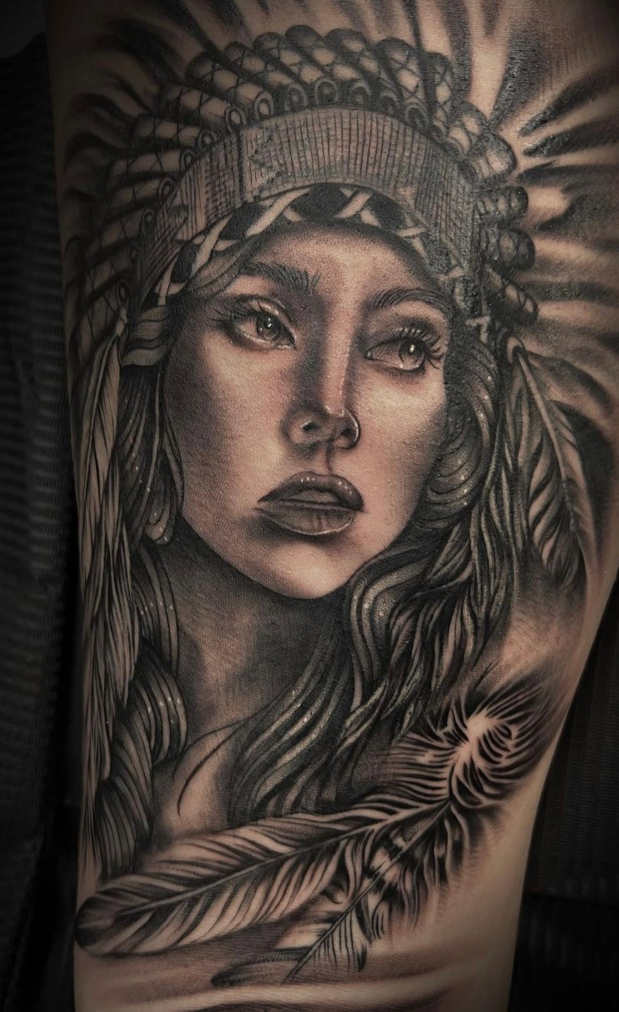 Black and grey native portrait by tattoo artist Yvon_ink at Sundog Studios Airdrie Tattoo Shop