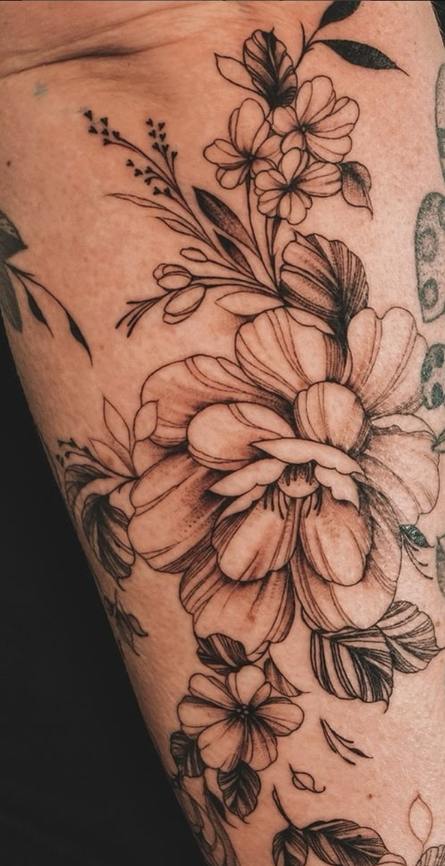Fine line floral tattoo tattooed by Yvon_ink at Sundog Studios Airdrie Tattoo Shop