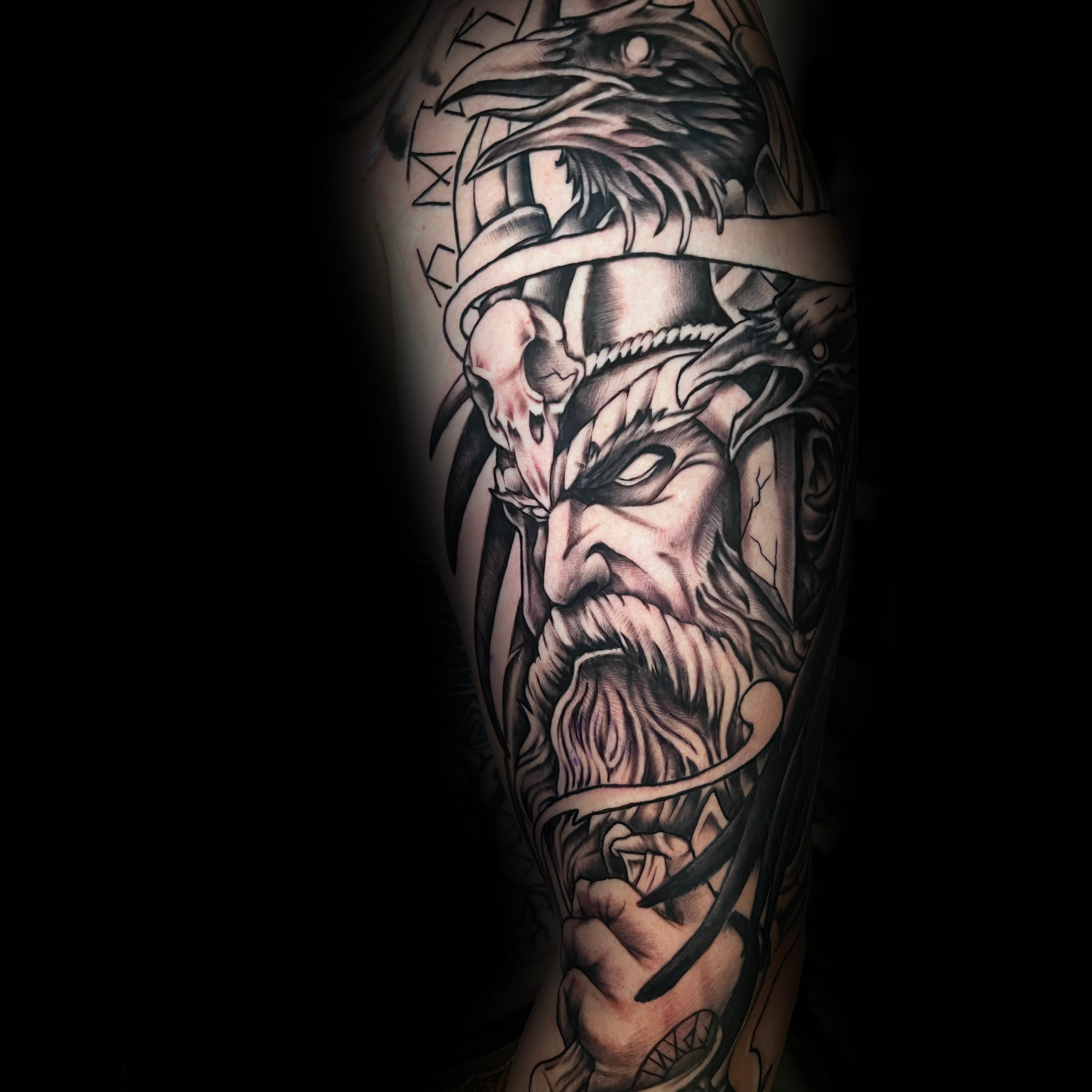 Detailed tattoo of a warrior with crows and beard by Dominic, tattoo artist at Sundog Studios in Airdrie Alberta