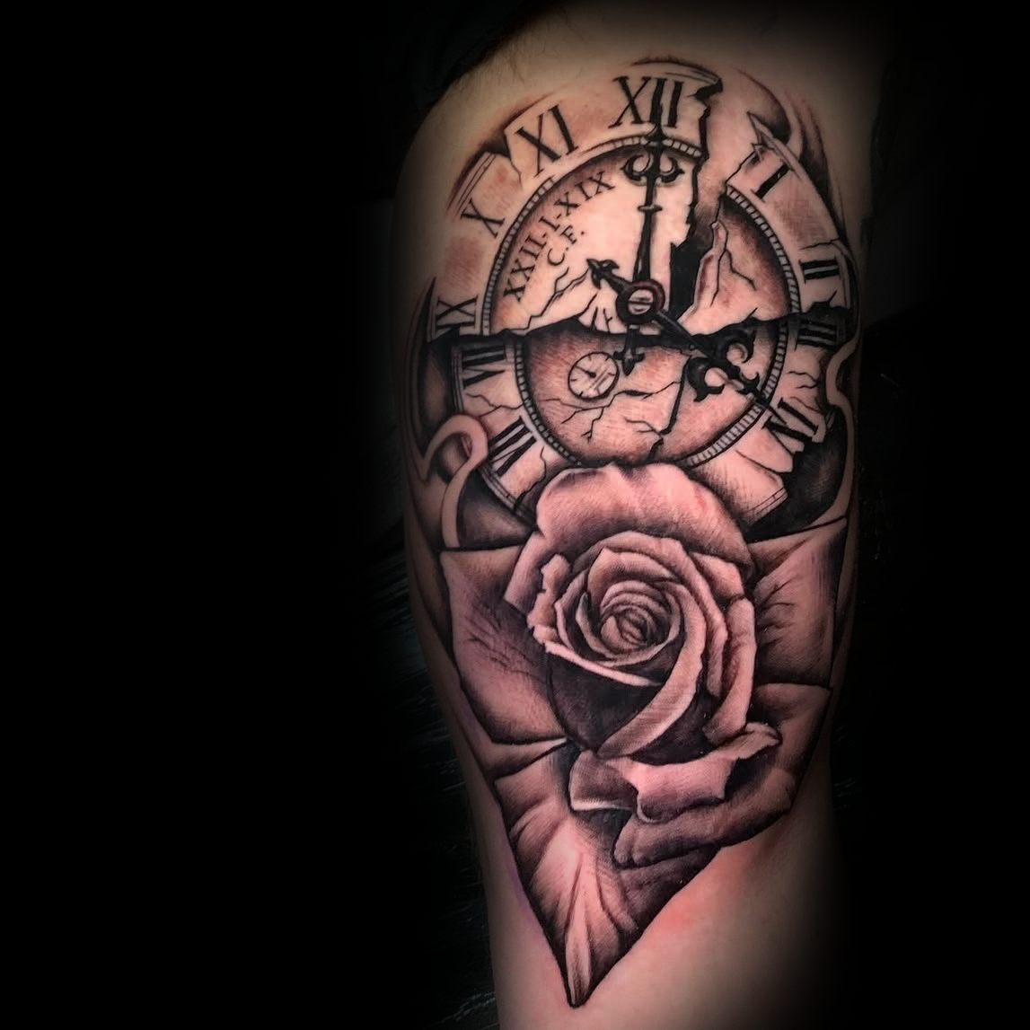 Detailed tattoo of a broken clock and rose on a person's arm with black and gray colors by Dominic, tattoo artist at Sundog Studios in Airdrie Alberta