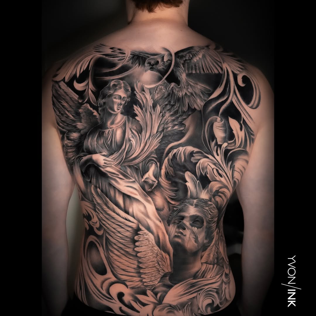 Black and grey full back tattoo featuring angels, wings and classical portrait figures by Yvon_ink at Sundog Studios in Airdrie Alberta