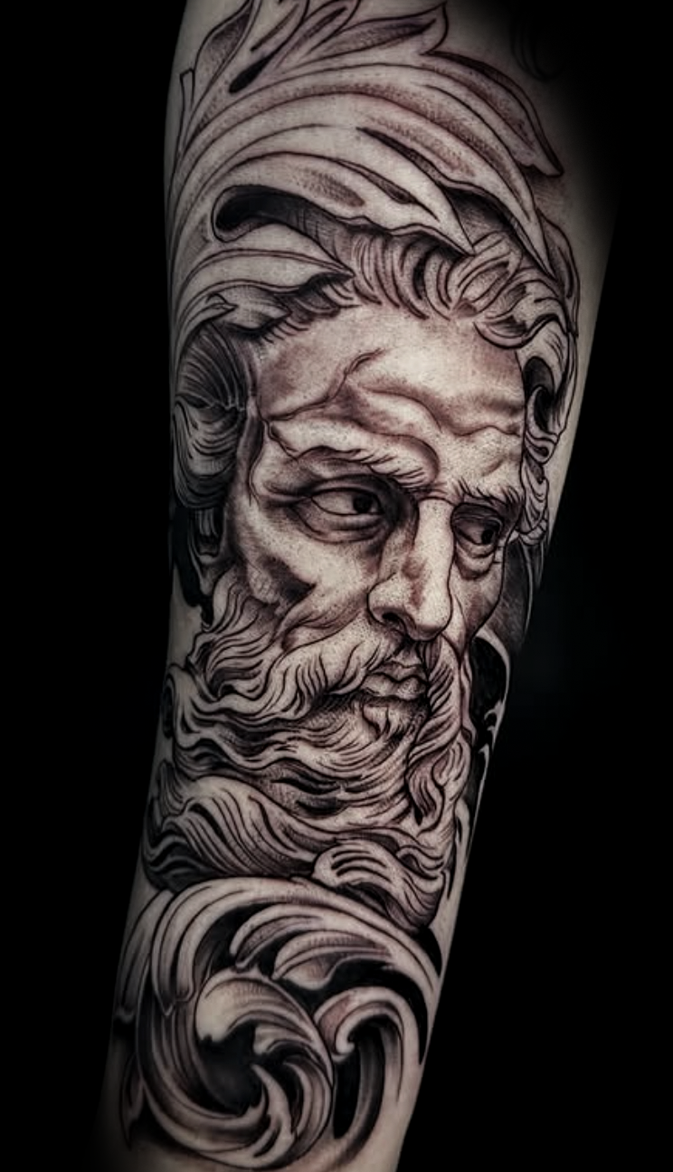 Black and grey realism Greek god statue forearm tattoo with filigree by Yvon_ink at Sundog Studios in Airdrie Alberta