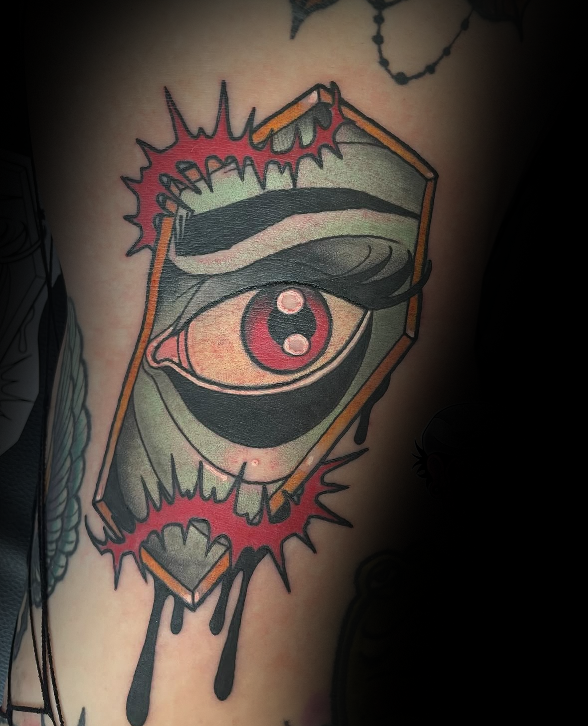 Colour tattoo of an eye with a geometric frame by Rob Adams, tattoo artist at Sundog Studios in Airdrie Alberta