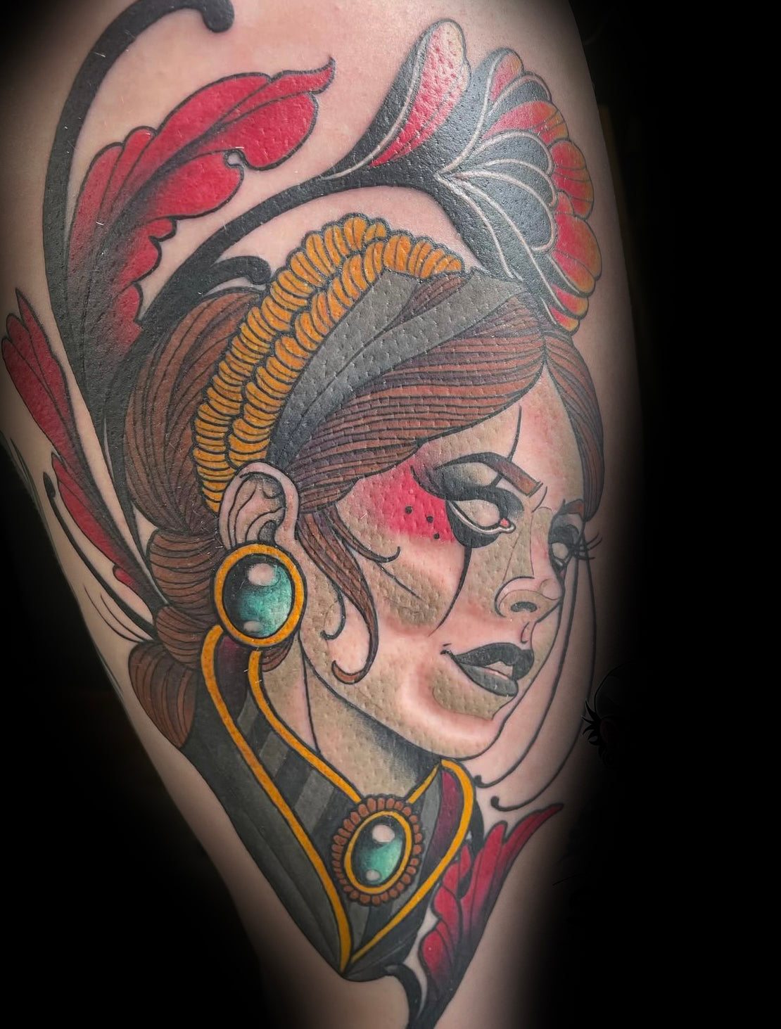Colour tattoo of a woman's face with intricate details by Rob Adams, tattoo artist at Sundog Studios in Airdrie Alberta