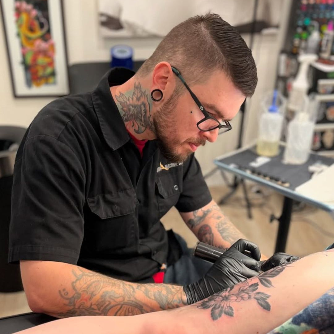 Modern Markings - Dominic tattooing a client at Sundog Studios in Airdrie Alberta 