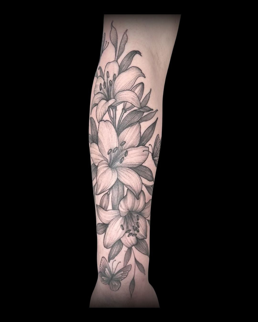 Fine line Tattoo of flowers on a person's arm, by Mahala, tattoo artist at Sundog Studios in Airdrie Alberta