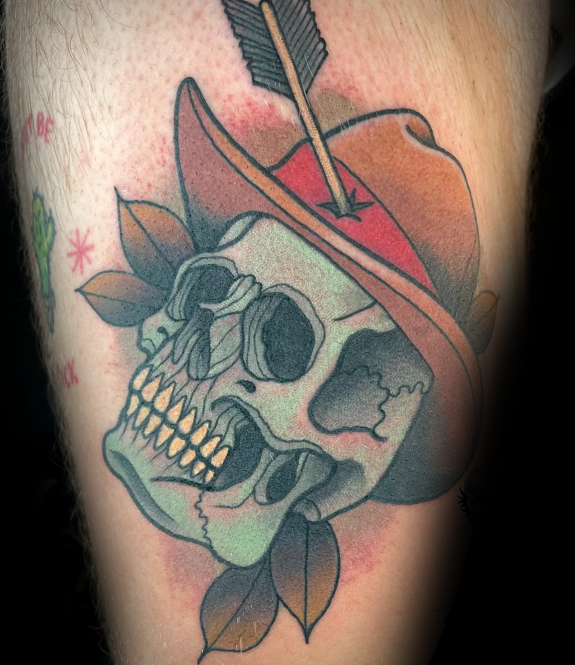 Colour tattoo of a skull with a hat and arrow by Rob Adams, tattoo artist at Sundog Studios in Airdrie Alberta